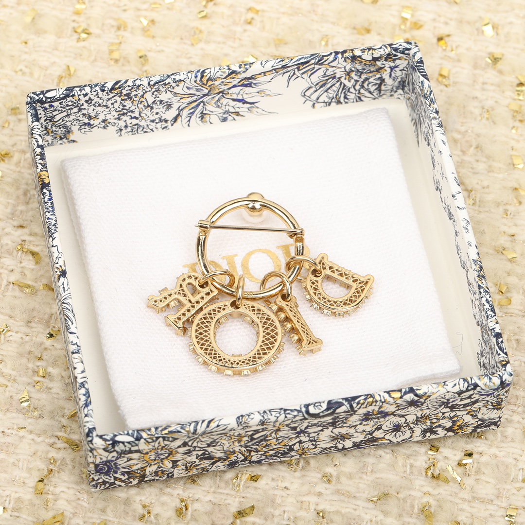 Dior diamond letter brooch