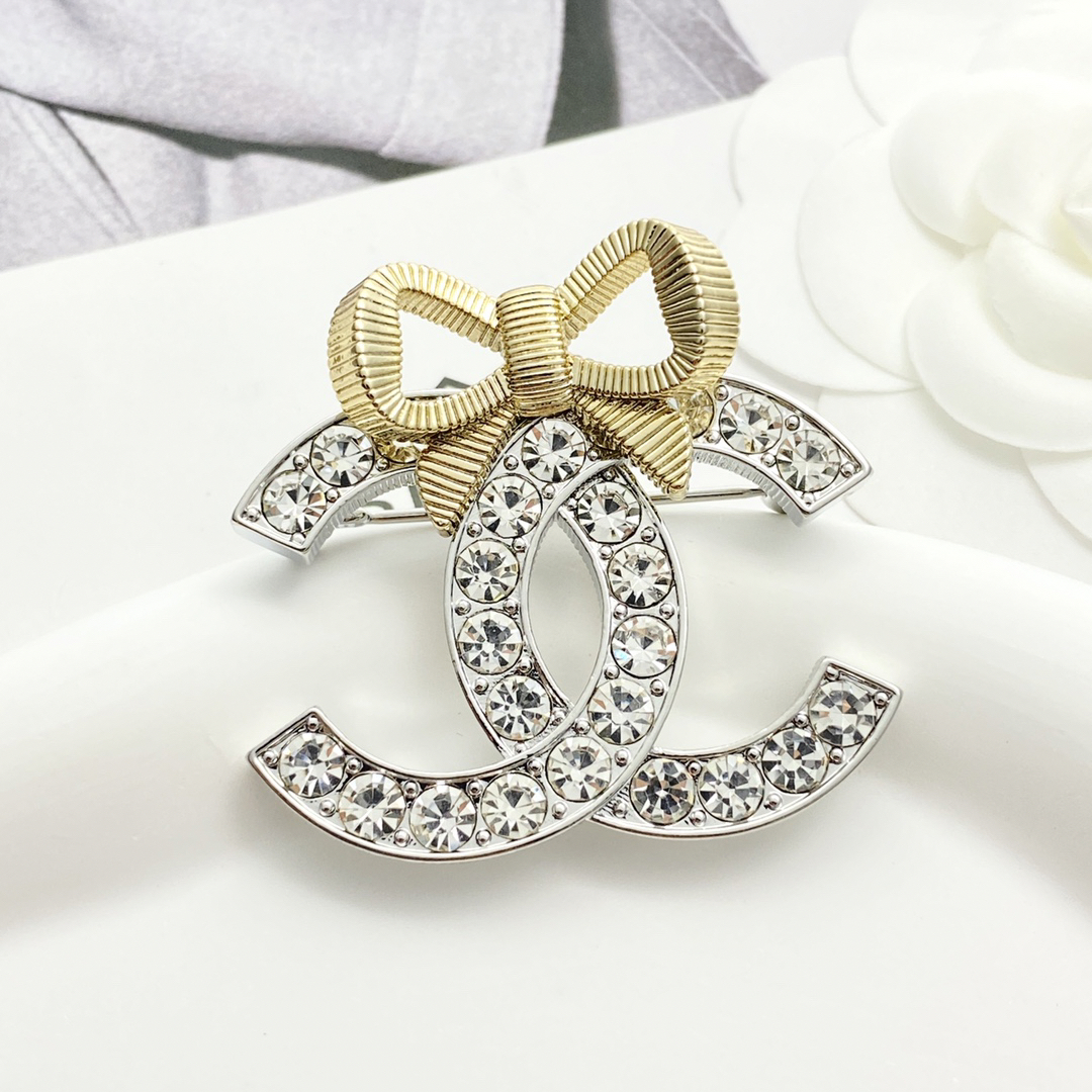 CHAN 24 gold and silver three-dimensional bow brooch