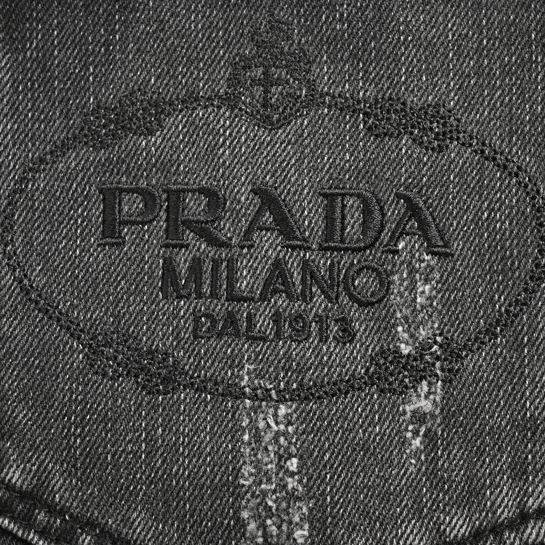 Prada 23Fw washed jeans with triangle logo embroidery