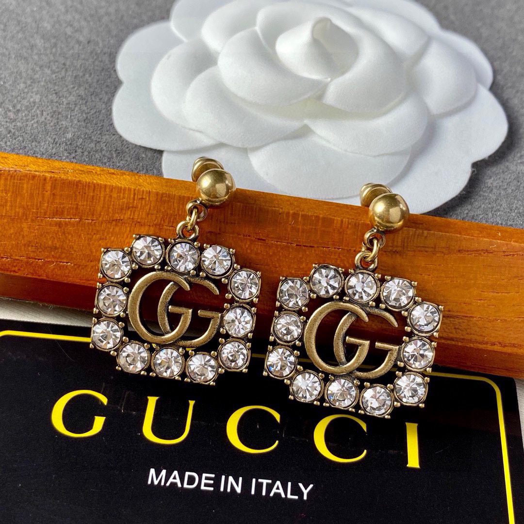 GUCCi diamond-studded GG gold earrings
