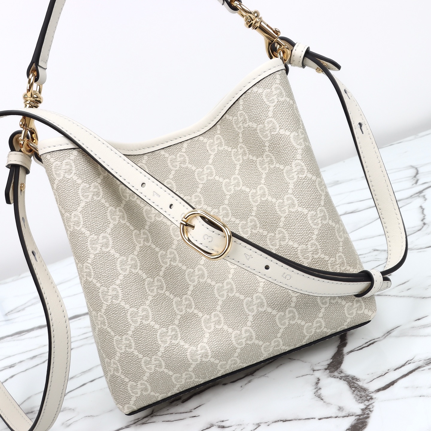 Gucci GG Emblem small bucket bag ‎815118 FAD6L 9641