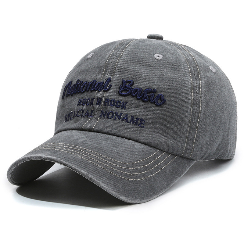 Fashionable washed denim baseball cap with wide brim, a curved visor, and sun protection.