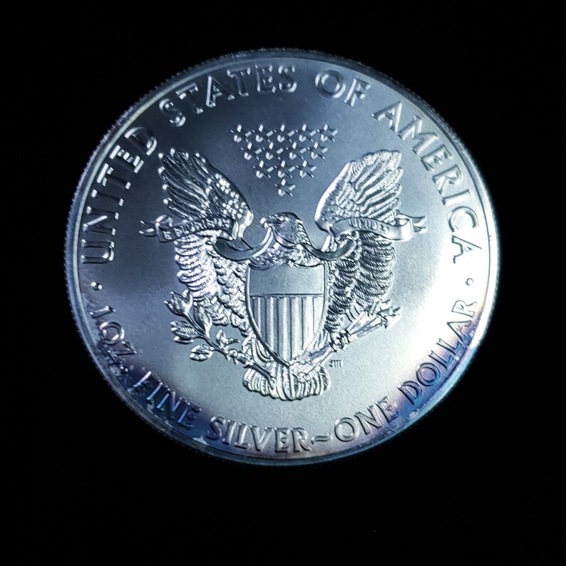 2011   American Silver Eagle BU  -  1 Oz .999 Cool toning on the rim-     Lot# 1210   Key date