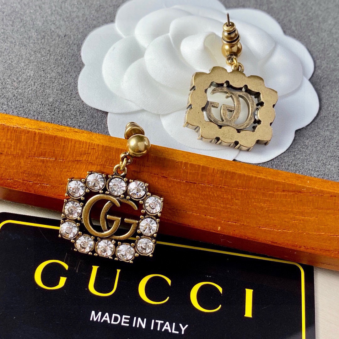 GUCCi diamond-studded GG gold earrings