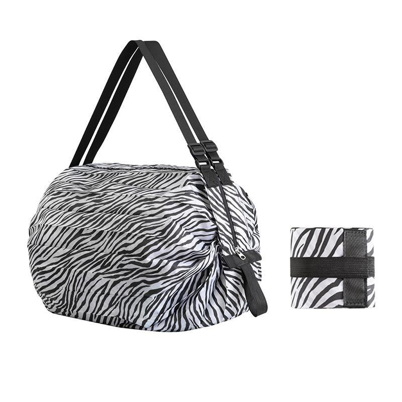 (🔥Last Day Promotion-SAVE 50% OFF) --Foldable Travel Portable Shopping Bag(Random Color Giveaway)-BUY 3 GET 2 FREE & FREE SHIPPING
