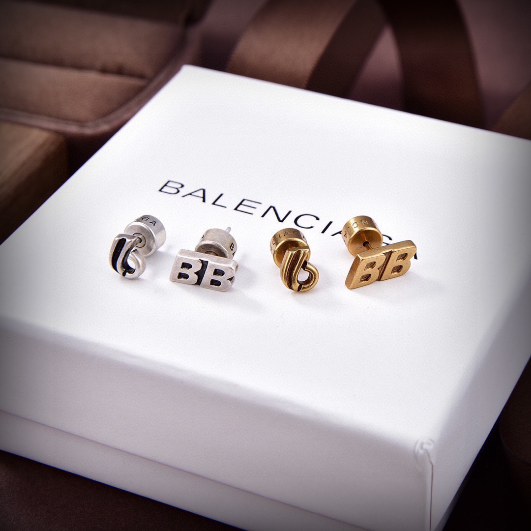 Balenciaga distressed letter earrings