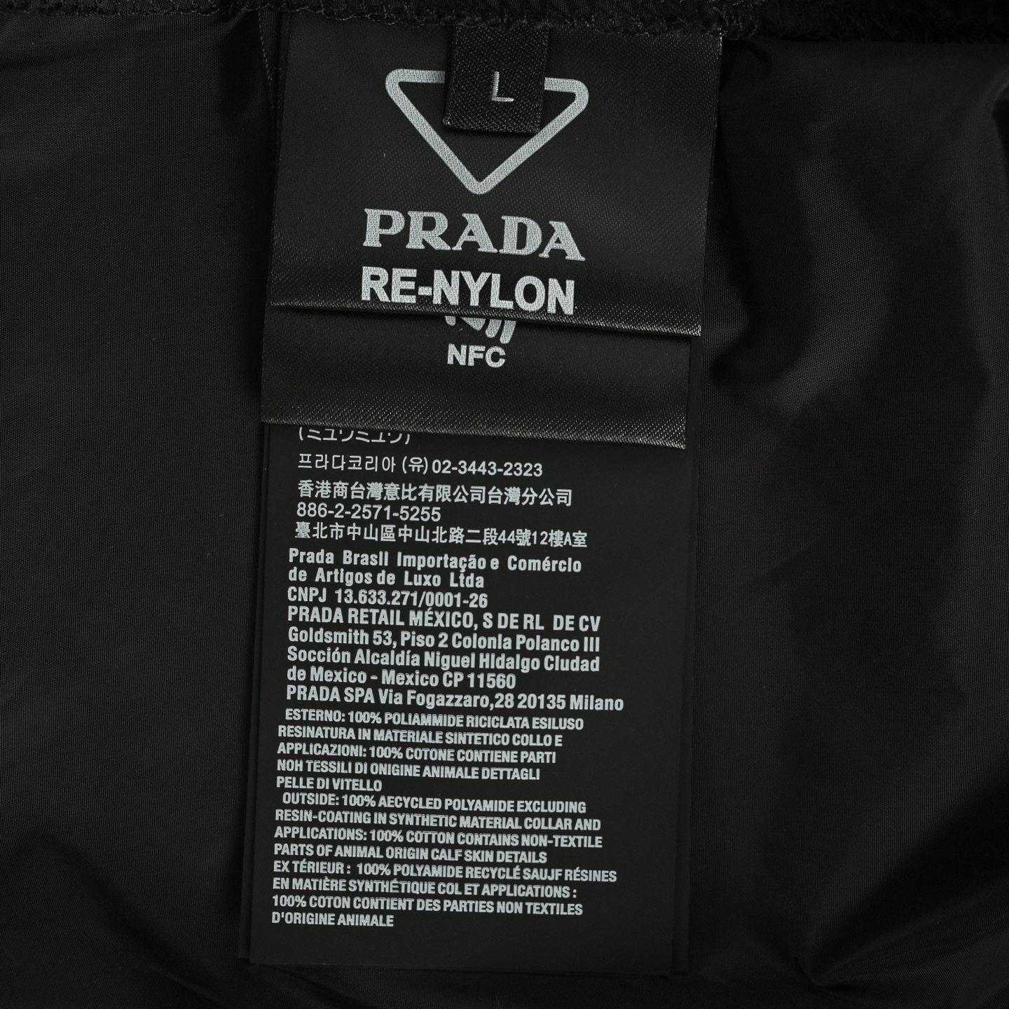 Prada 25Fw recycled nylon trousers with back flap pockets
