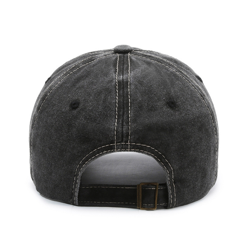 Fashionable washed denim baseball cap with wide brim, a curved visor, and sun protection.