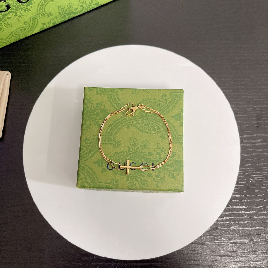 Gucci gold-tone cross bracelet