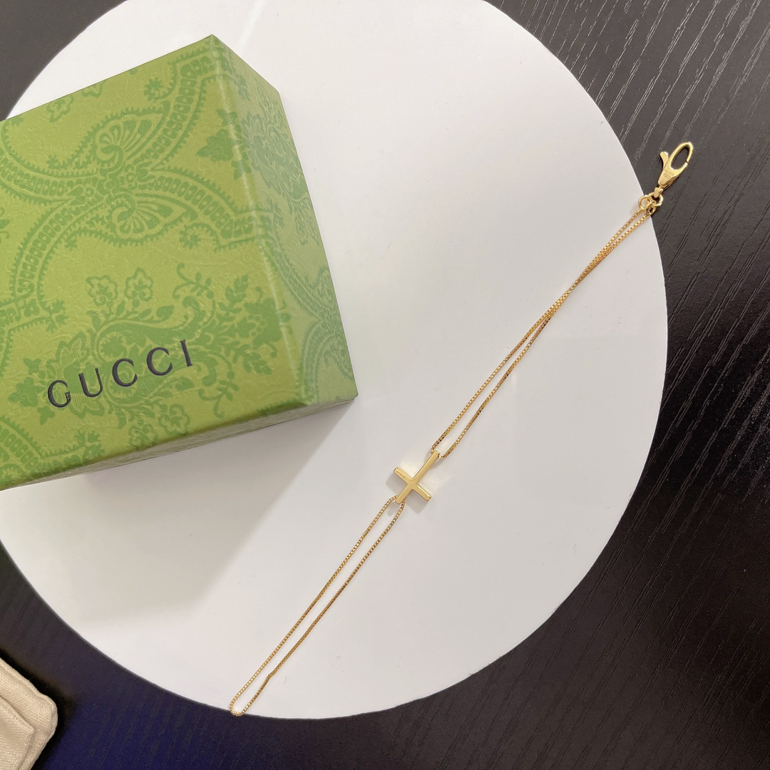 Gucci gold-tone cross bracelet