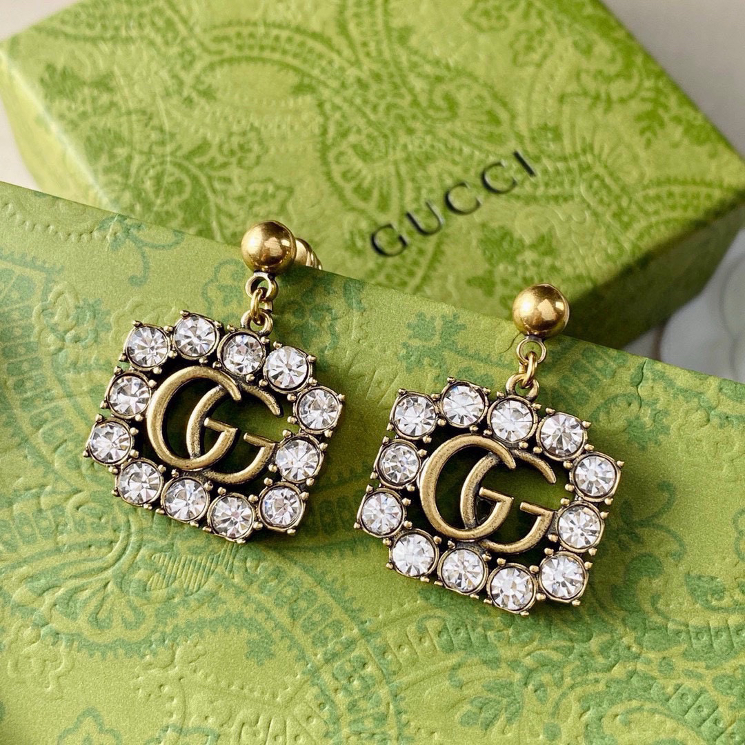 GUCCi diamond-studded GG gold earrings