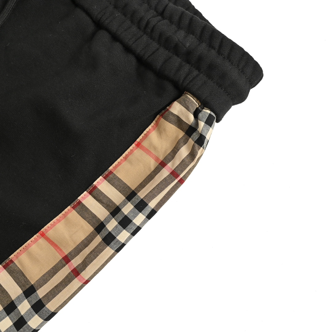 Burberry side-embossed logo check trousers
