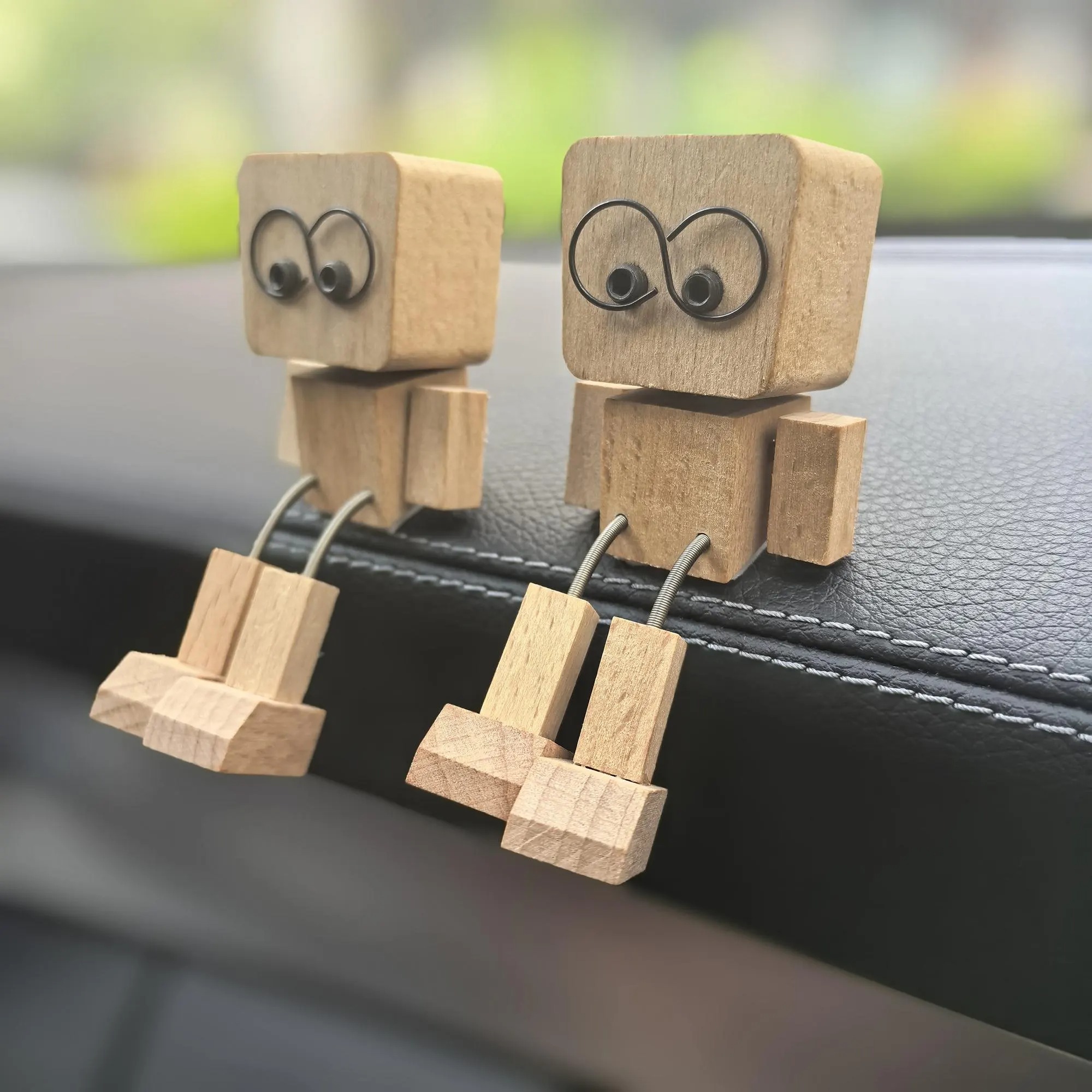 Wooden figurine with leg shaking