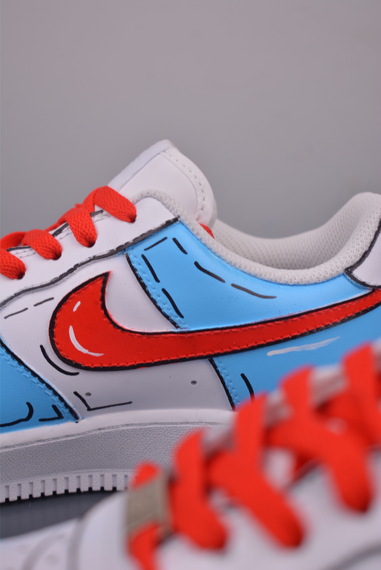 Doraemon collaboration Nike Air Force 1 Low hand-painted graffiti white, blue and red DD8959-100