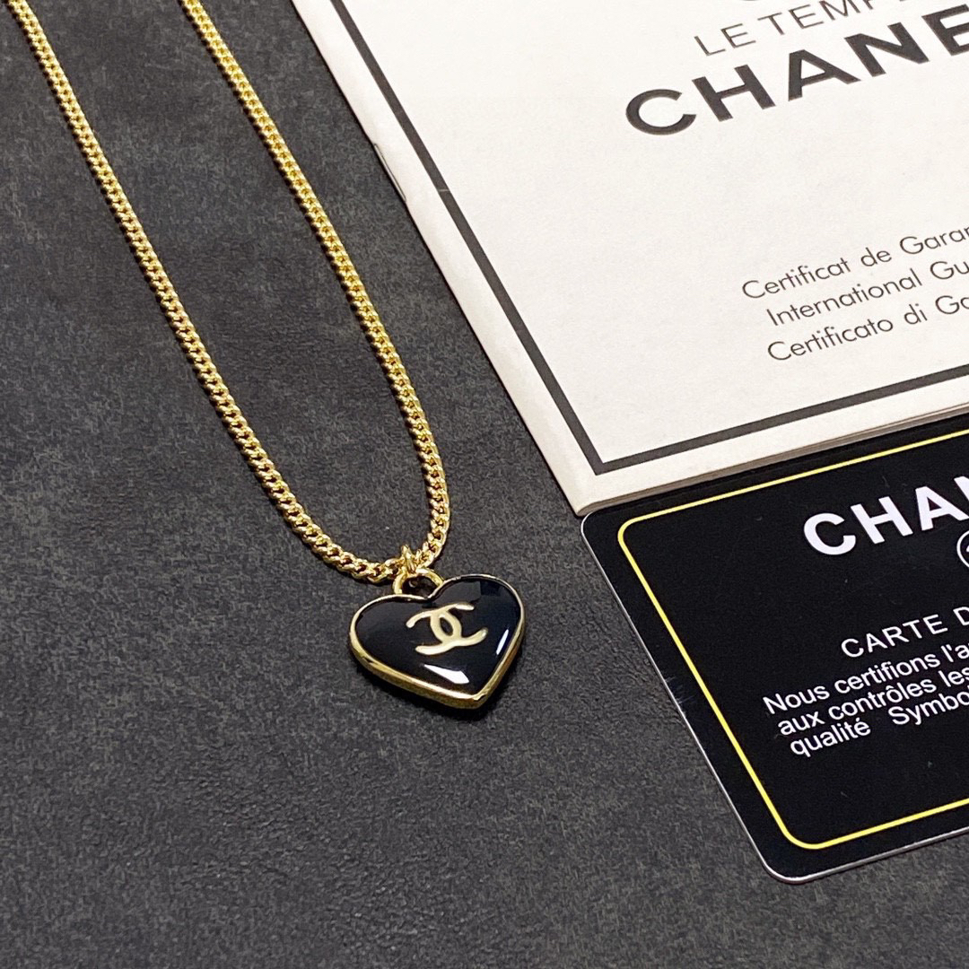 Chanel black heart double-sided necklace