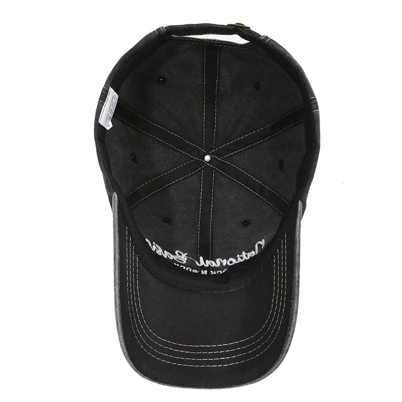Fashionable washed denim baseball cap with wide brim, a curved visor, and sun protection.