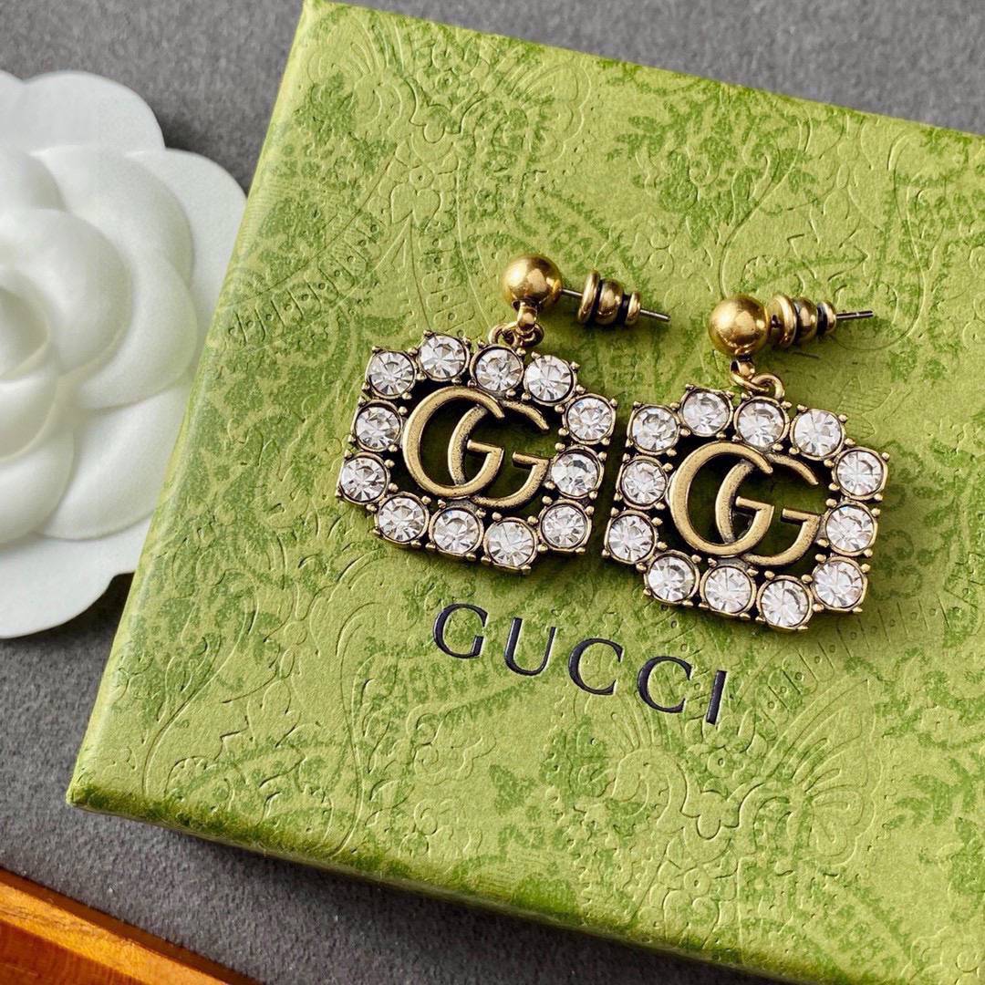 GUCCi diamond-studded GG gold earrings