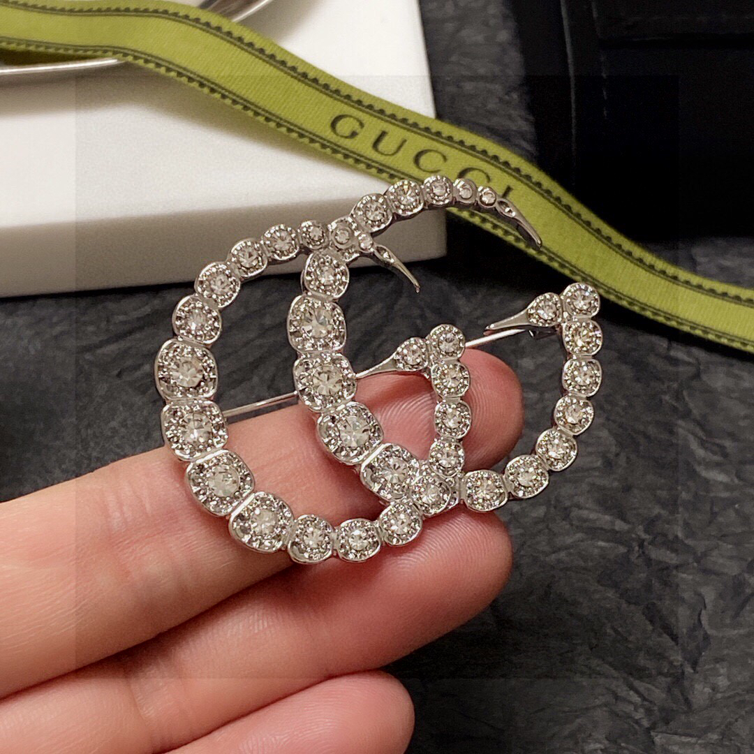 Gucci GG diamond brooch