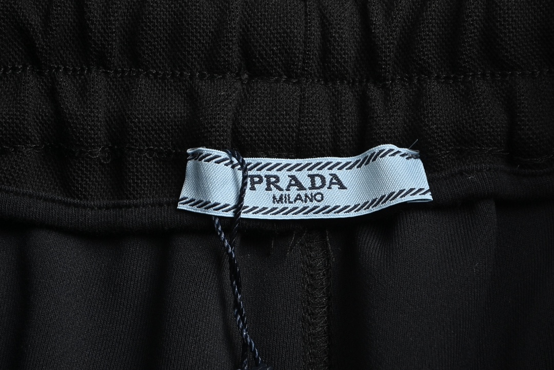 Prada 23Fw triangle logo patchwork suit trousers