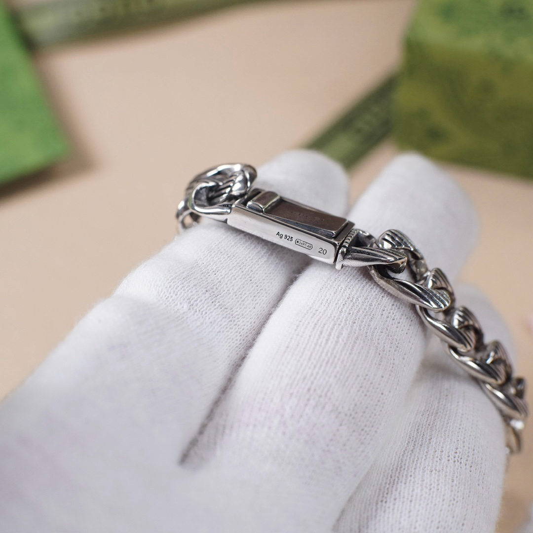 Gucci hand brand distressed bracelet