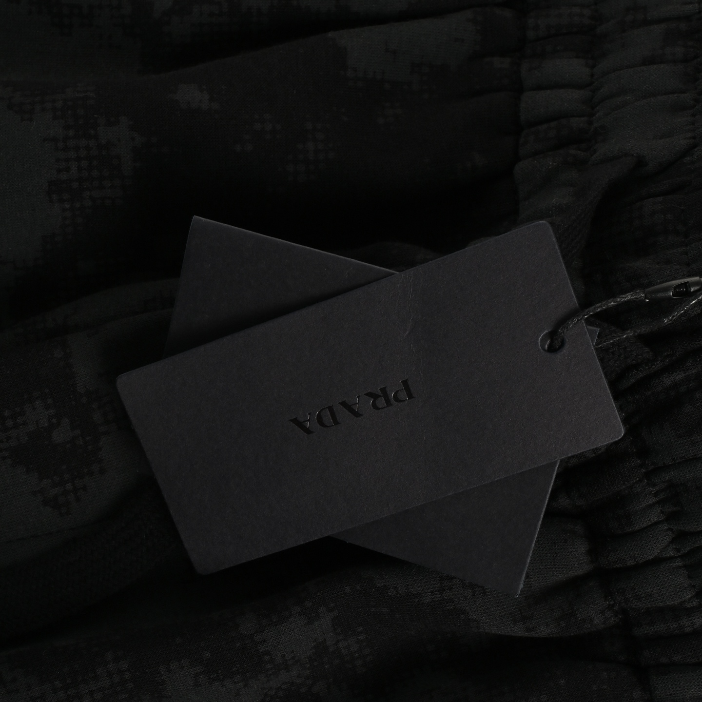 Prada black camouflage triangle logo shorts