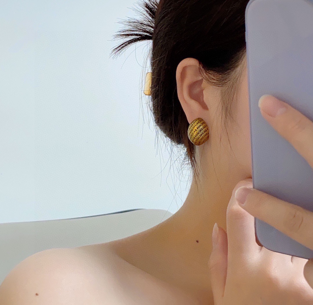 Balenciaga antique gold engraved letter earrings