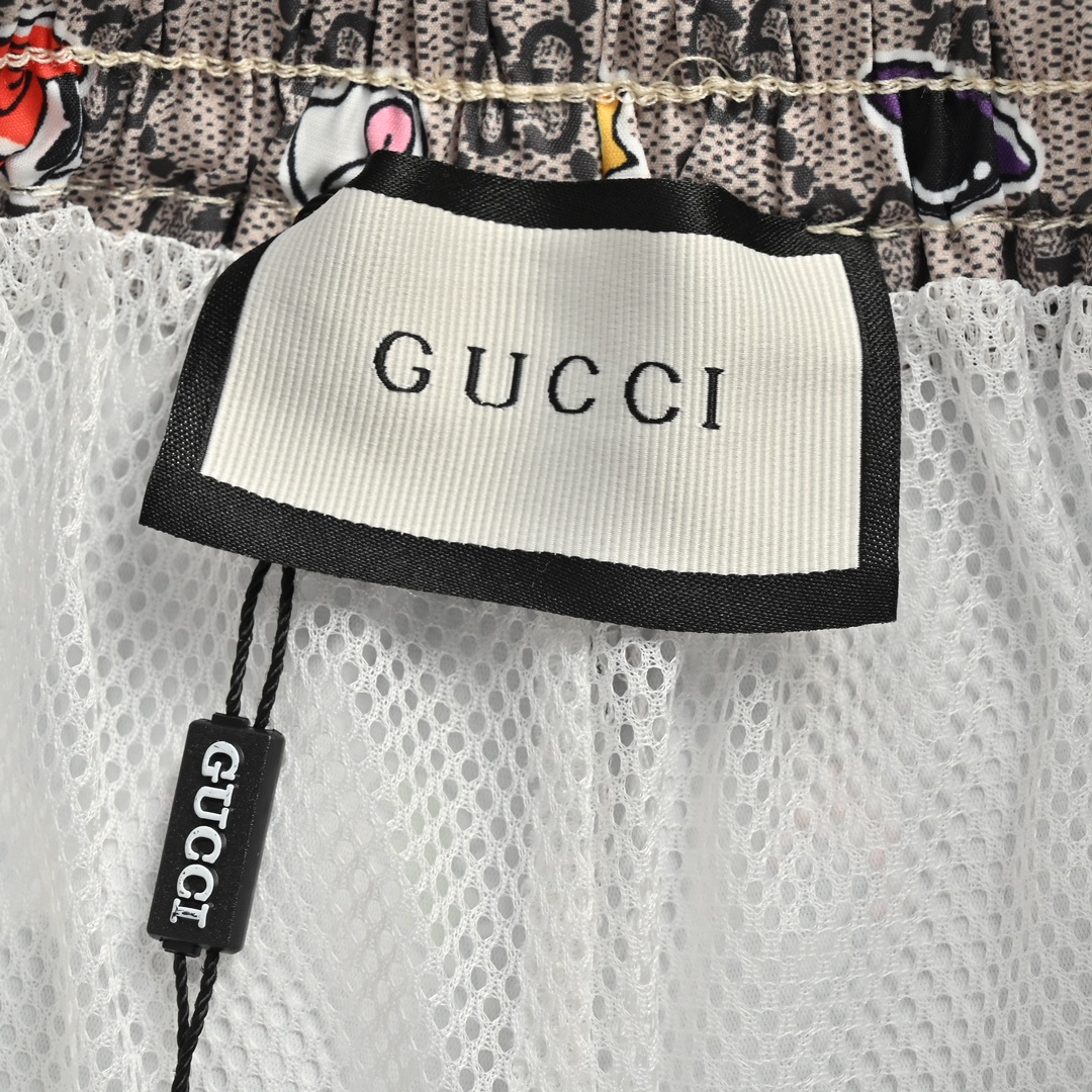 Gucci 24ss all over printed double G cartoon element beach shorts