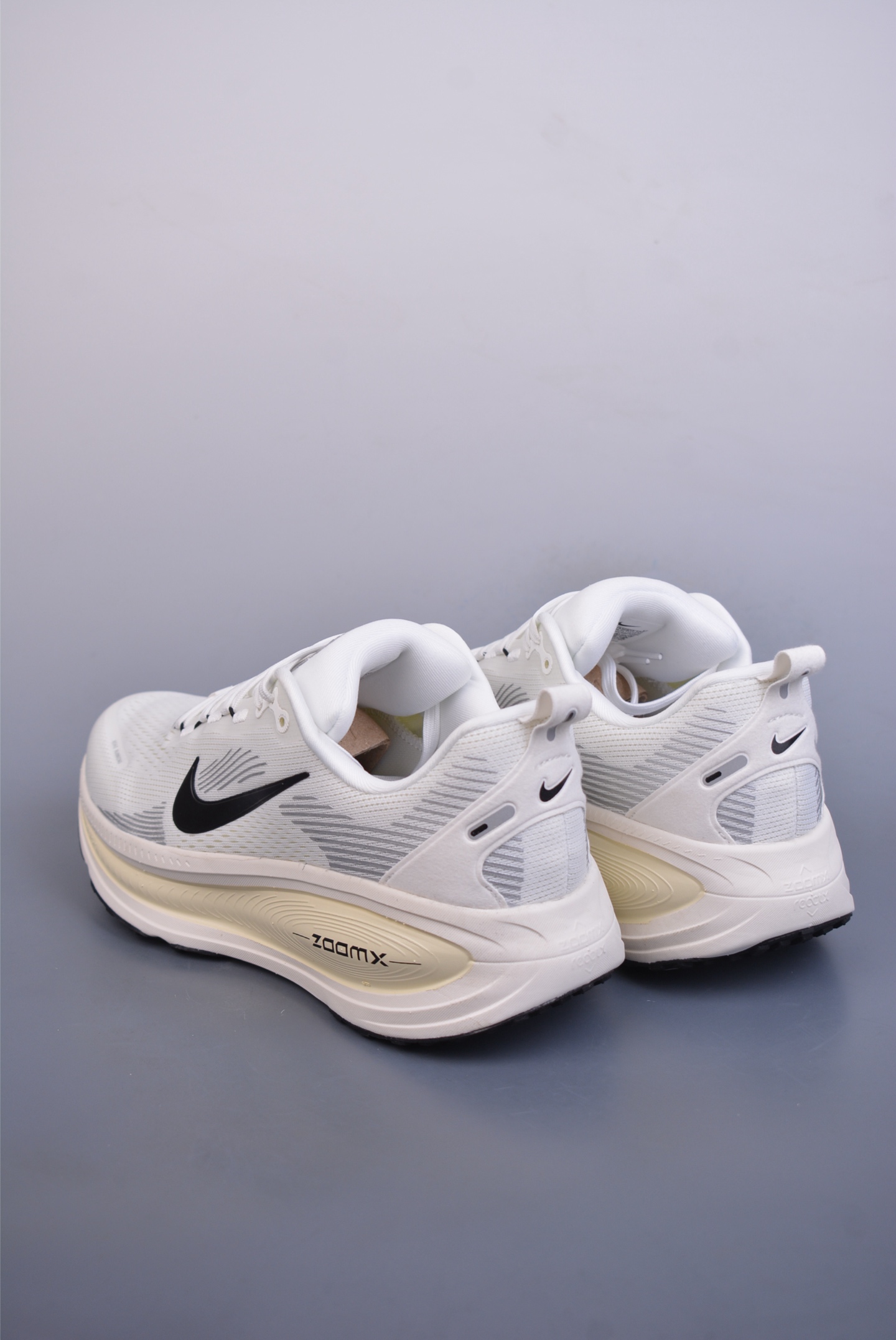 Nike Vomero 18 ZoomX running shoes off-white and black hook HM6803-101