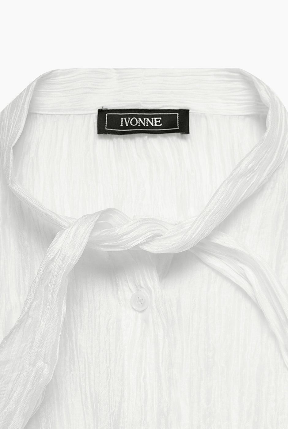 Blusa blanca de moño en cuello