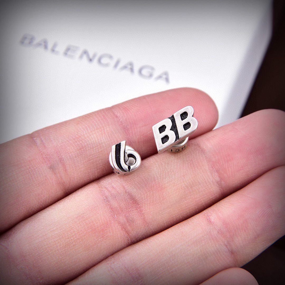 Balenciaga distressed letter earrings