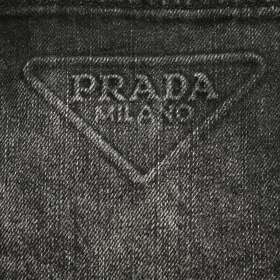 Prada 23Fw triangle logo embossed washed denim