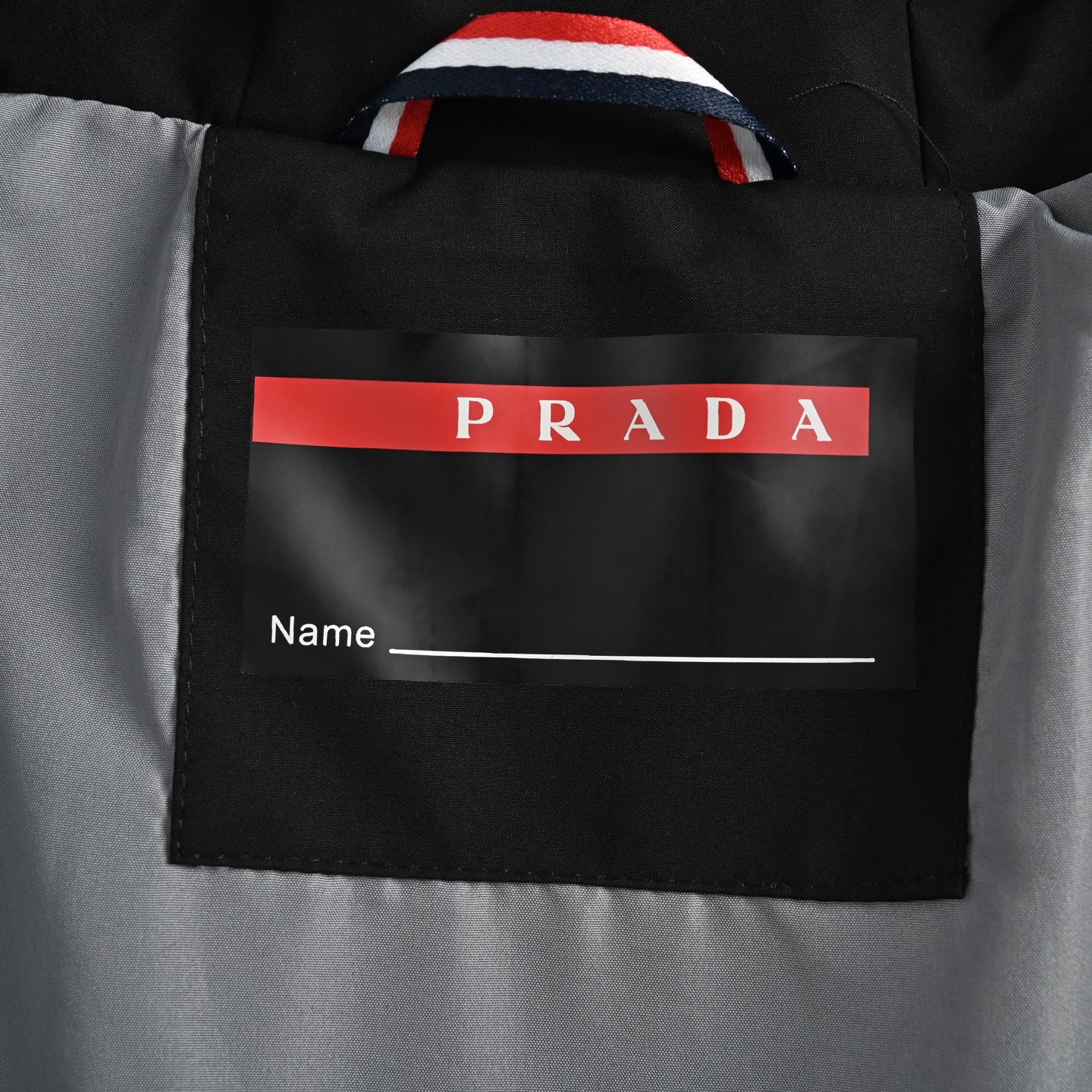 Prada 25ss metal triangle logo laminated zipper jacket