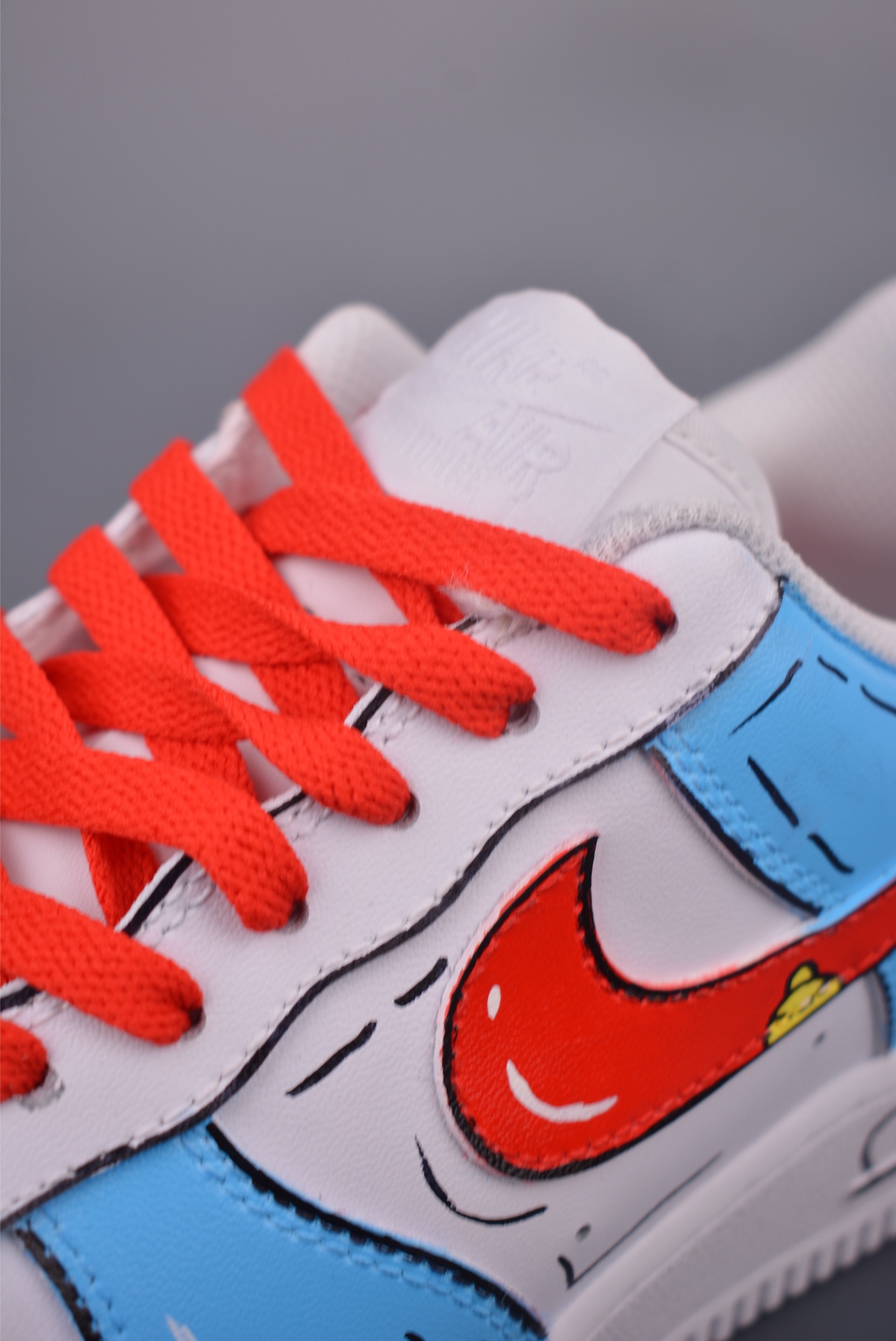 Doraemon collaboration Nike Air Force 1 Low hand-painted graffiti white, blue and red DD8959-100