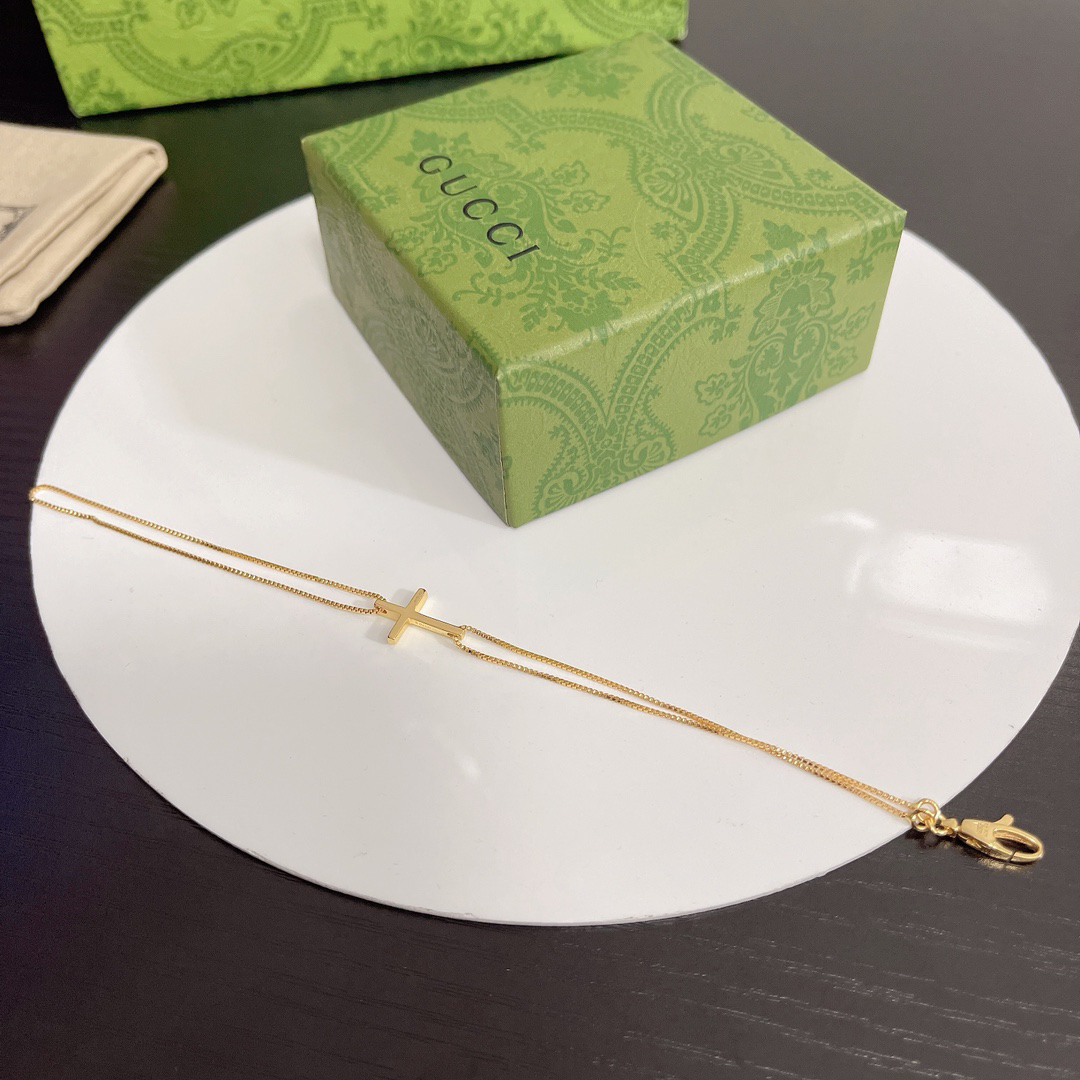 Gucci gold-tone cross bracelet
