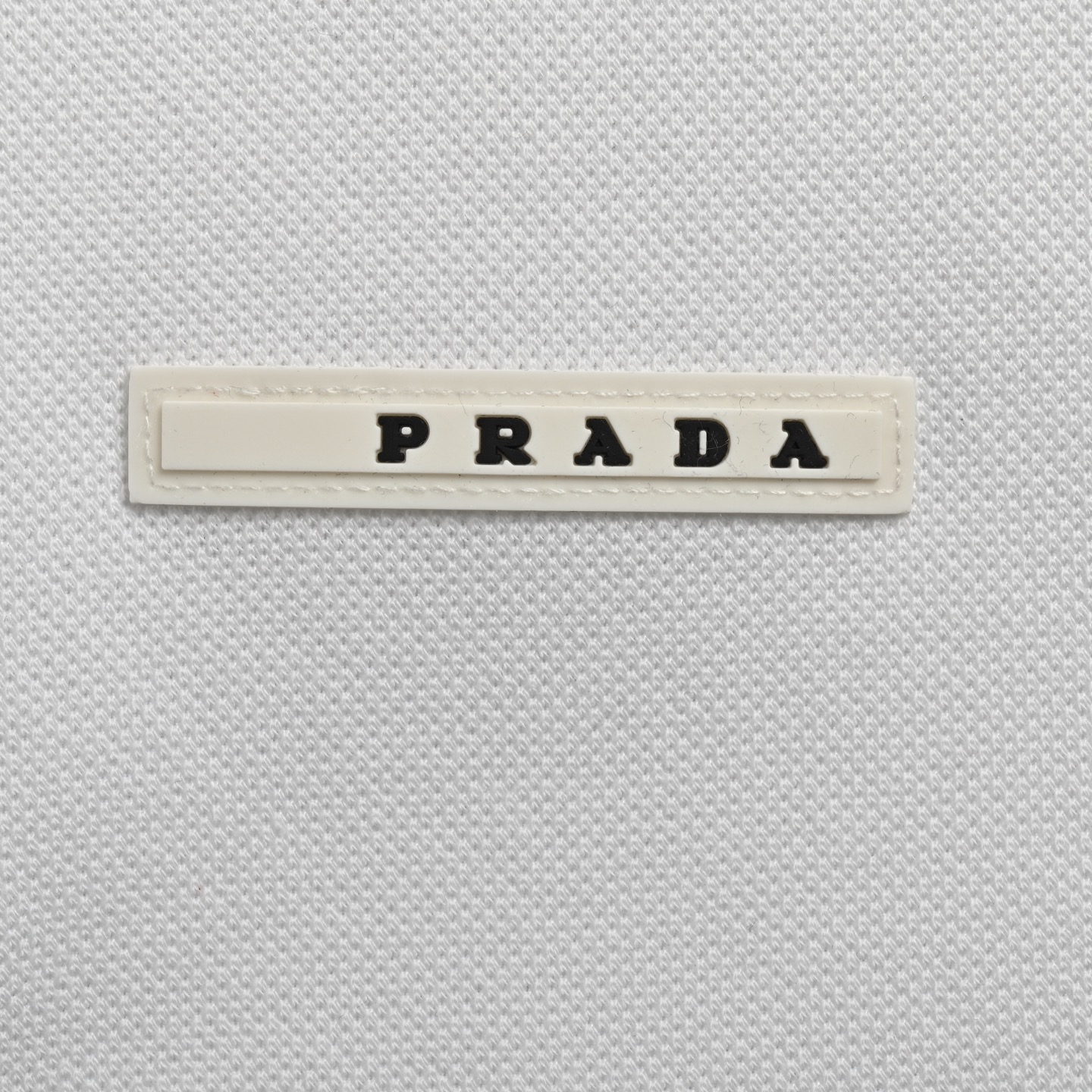 Prada Polo short sleeve with silicone trim on chest pocket