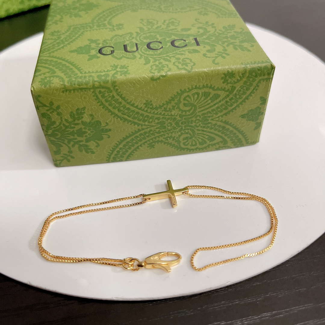 Gucci gold-tone cross bracelet
