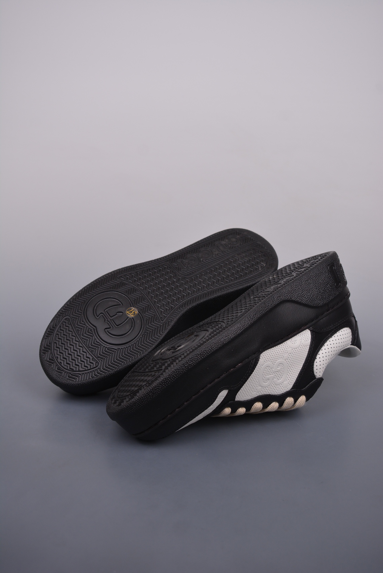 GUCCI punching black and white panda GG printed embossed