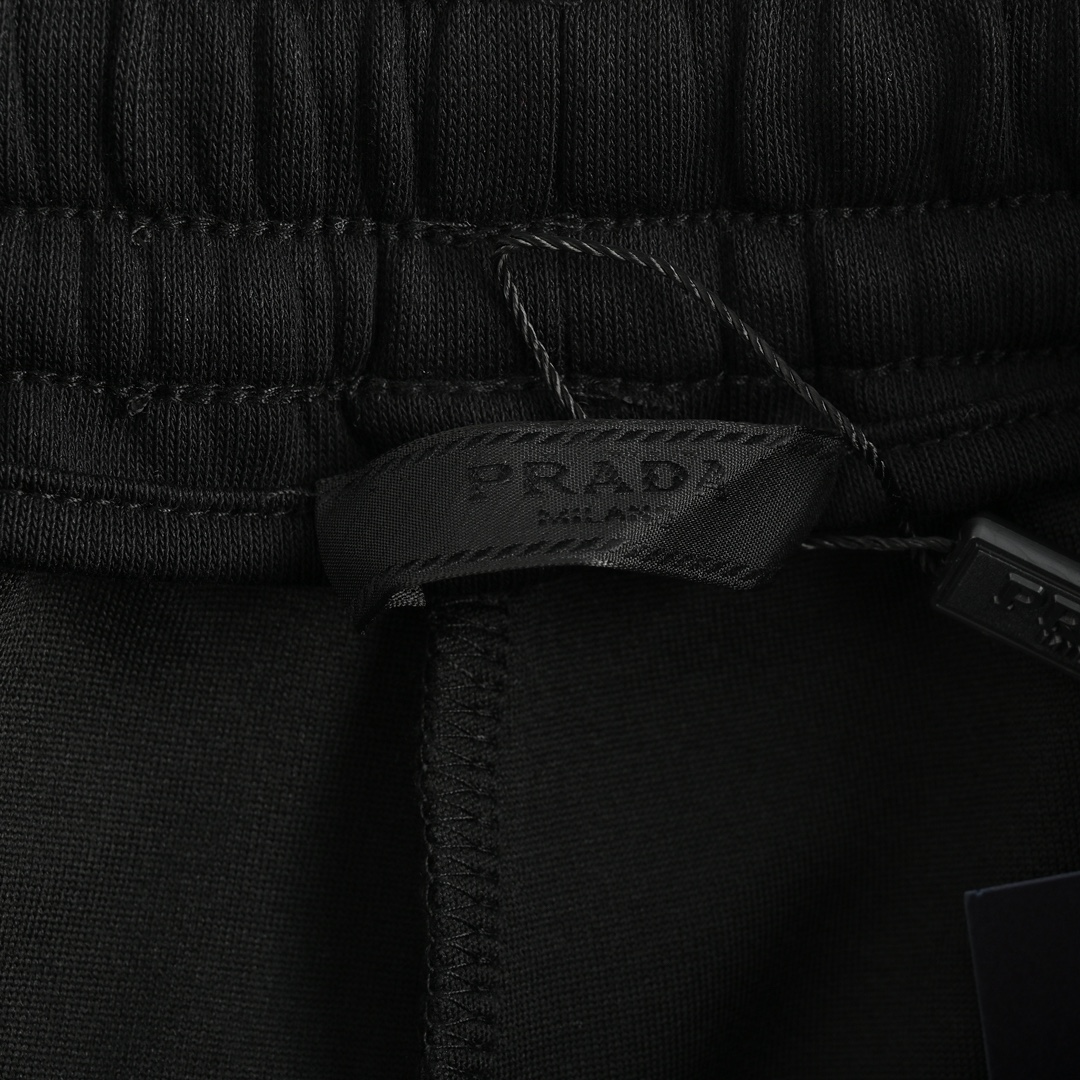 Prada embroidered logo trousers