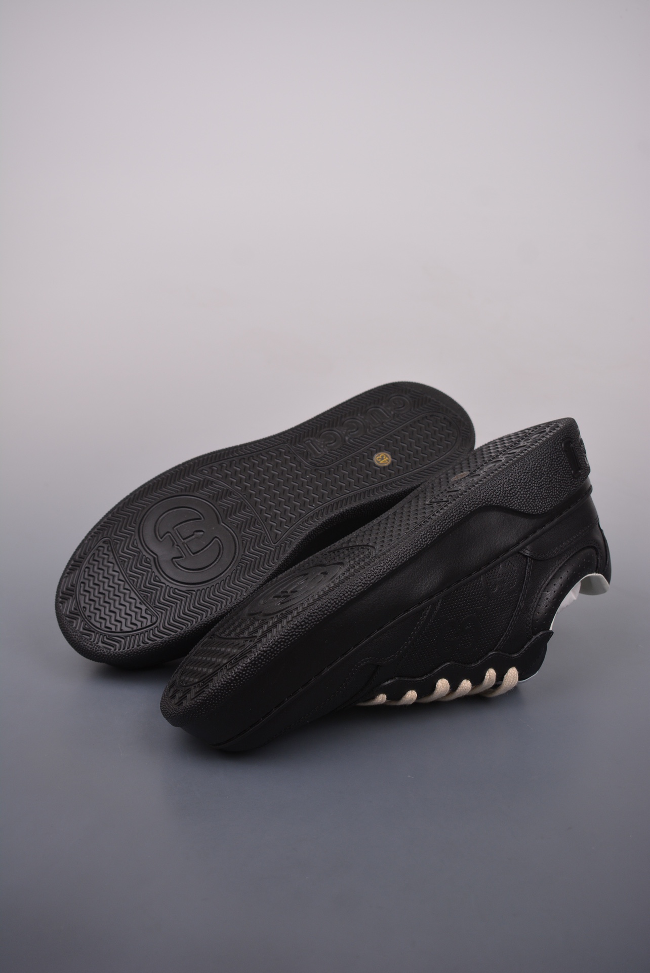 GUCCI punched leather all black gold GG print embossed