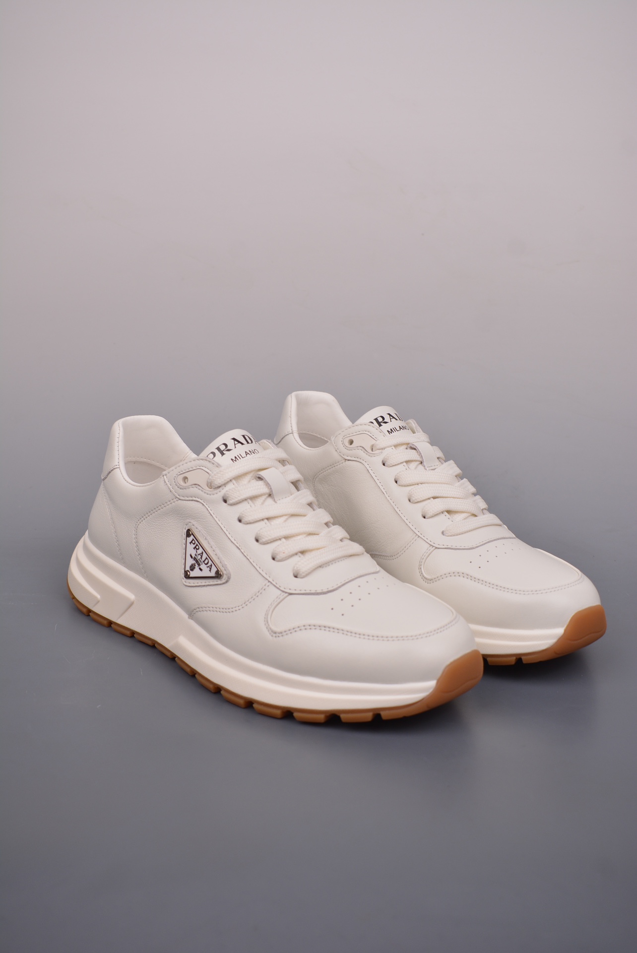 Prada PRAX 01 Triangle Logo Leather Sneakers off-white 3D936M_3LF5_FG000