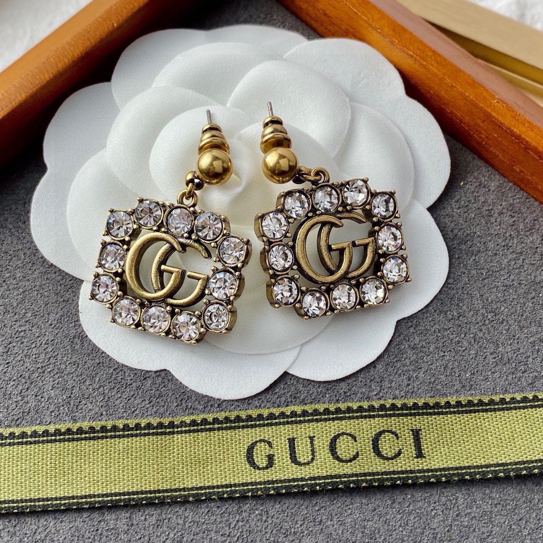 GUCCi diamond-studded GG gold earrings