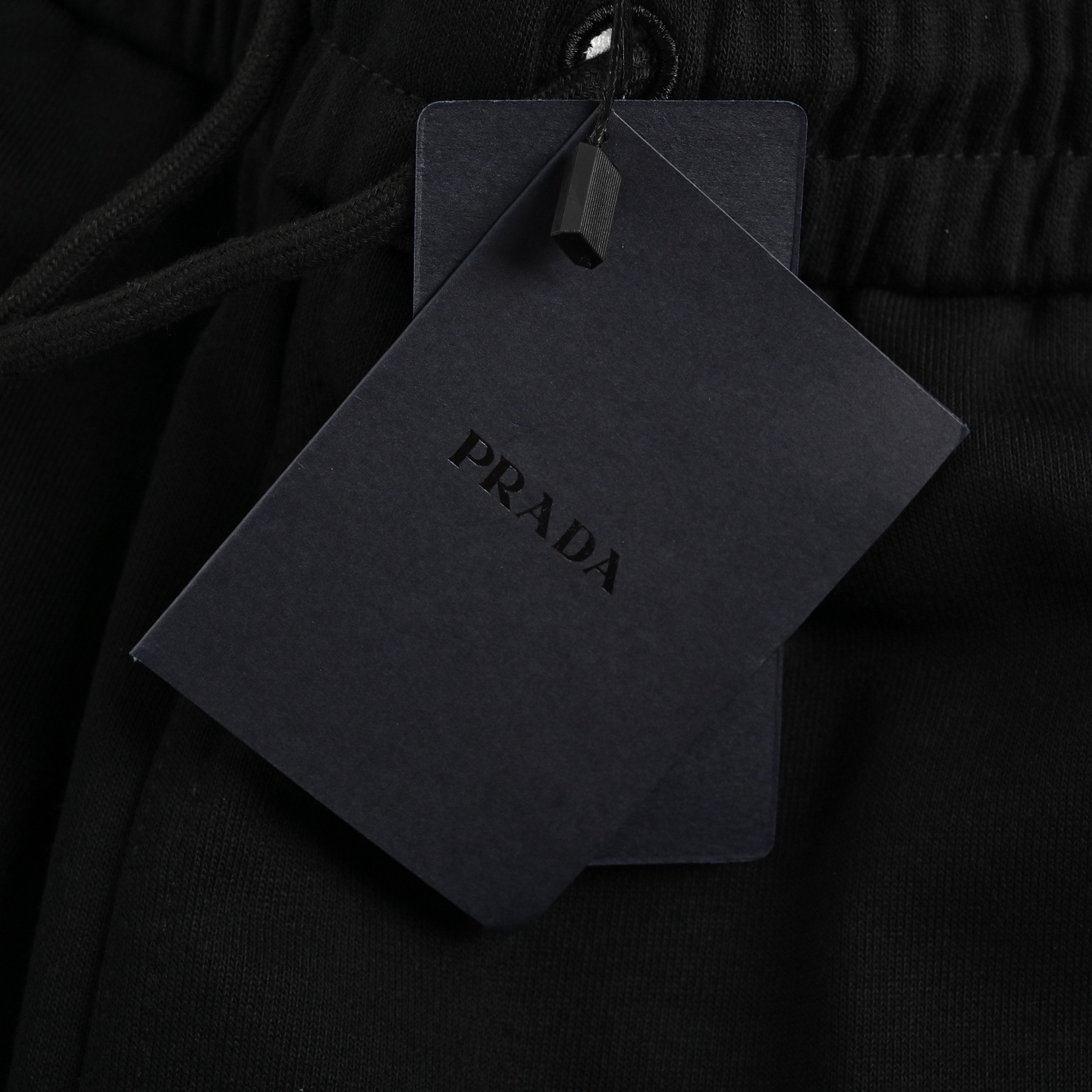 Prada triangle logo red rubber shorts