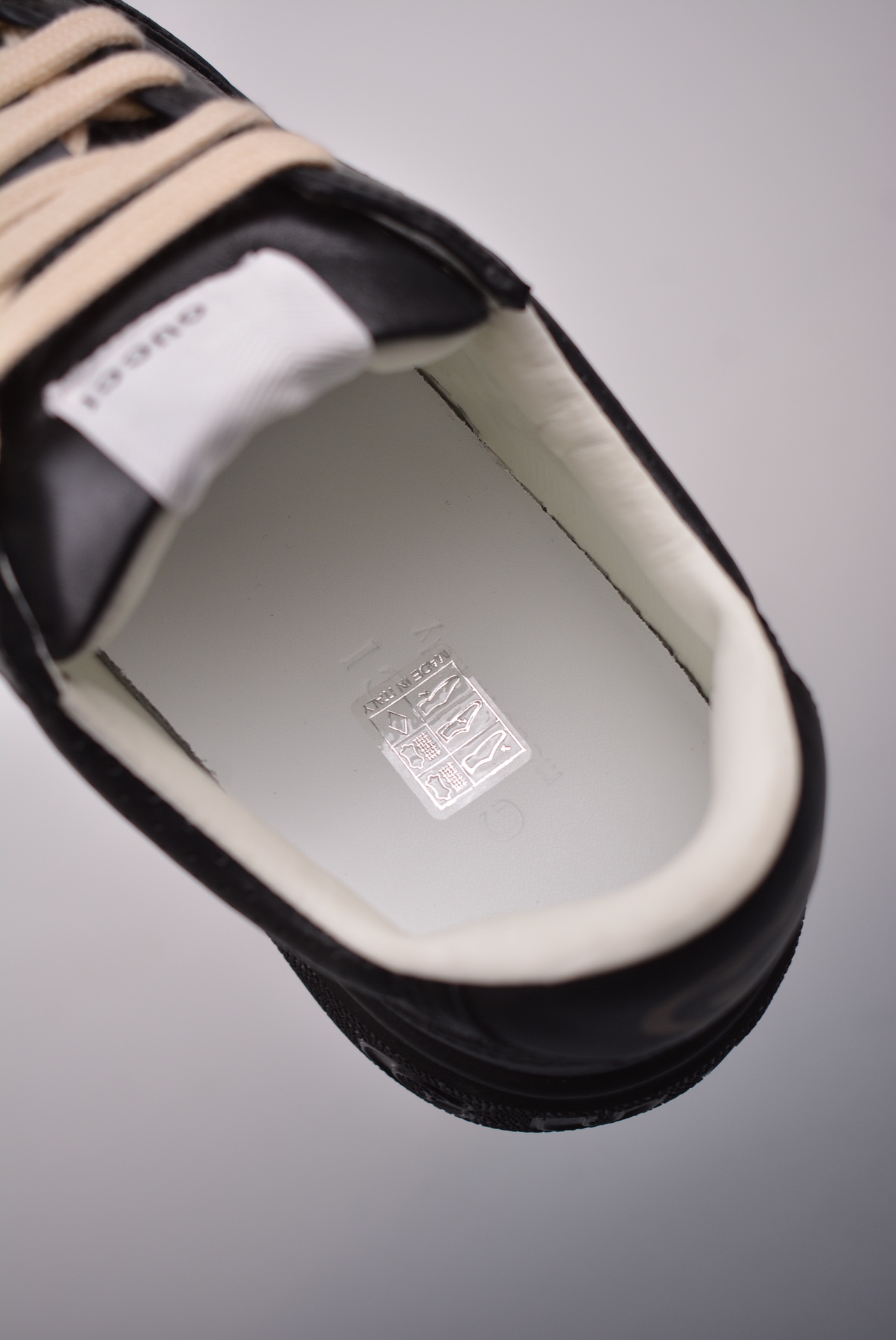 GUCCI punched leather all black gold GG print embossed