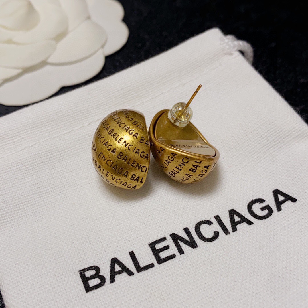 Balenciaga antique gold engraved letter earrings
