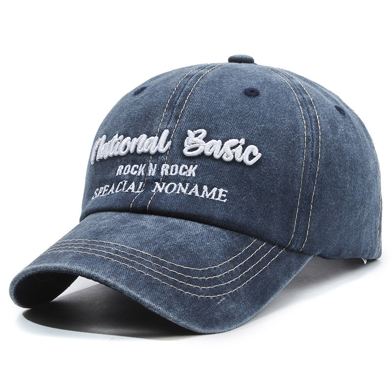 Fashionable washed denim baseball cap with wide brim, a curved visor, and sun protection.