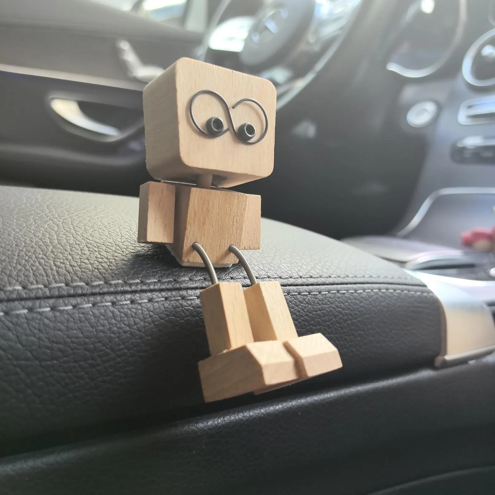 Wooden figurine with leg shaking