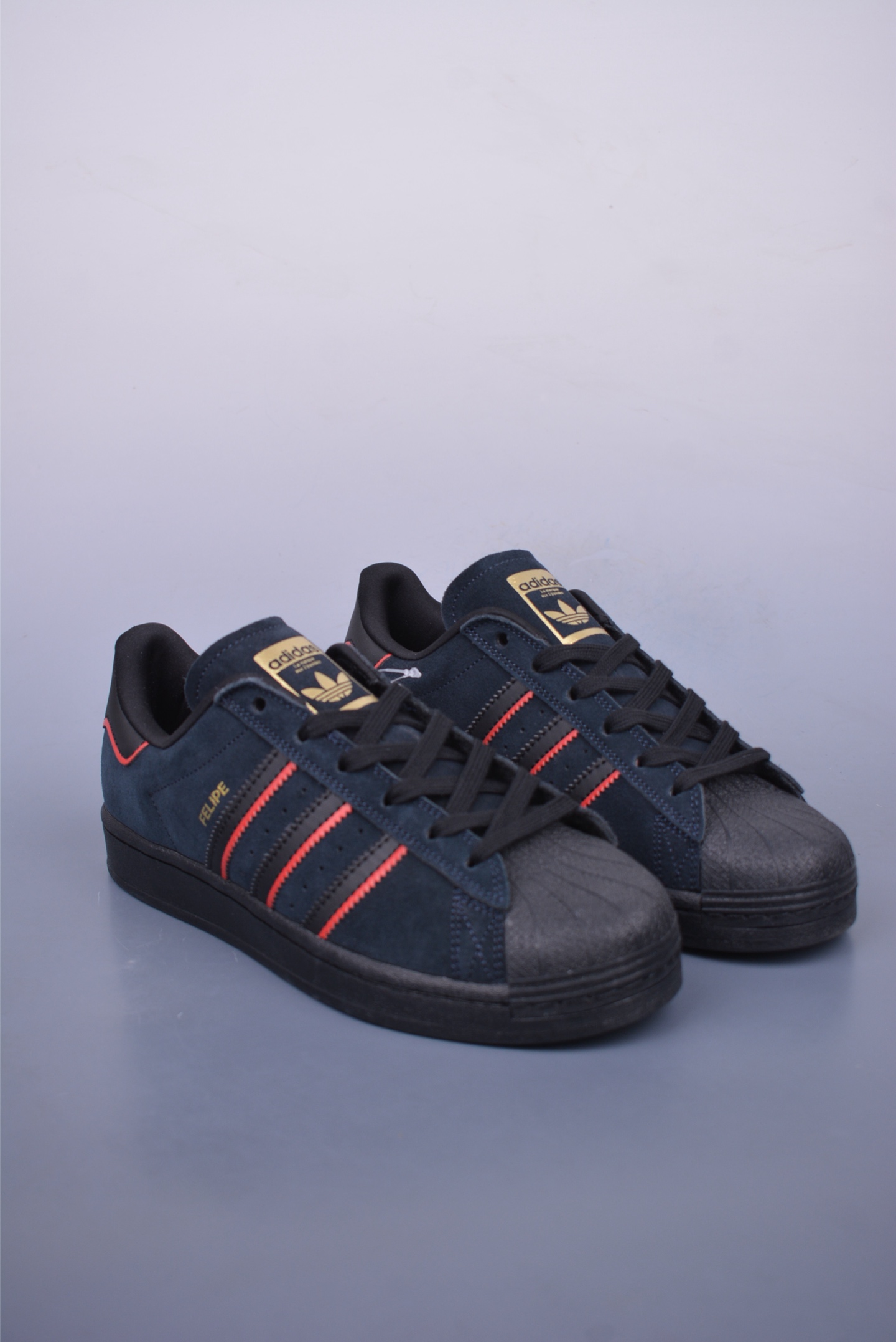 Felipe Gustavo x Adidas Superstar ADV sports shoes black, red and gold JR7831