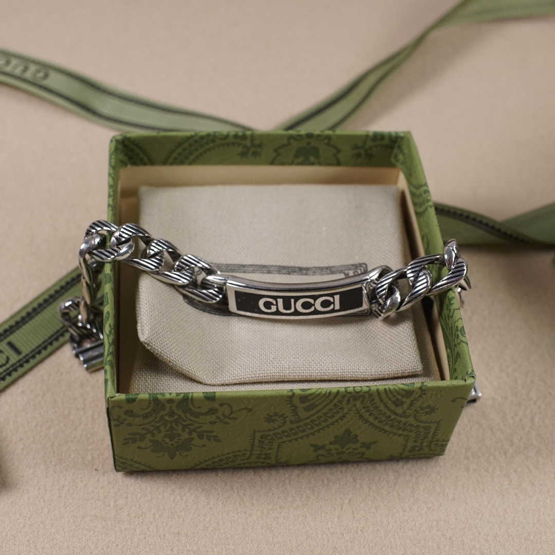 Gucci hand brand distressed bracelet