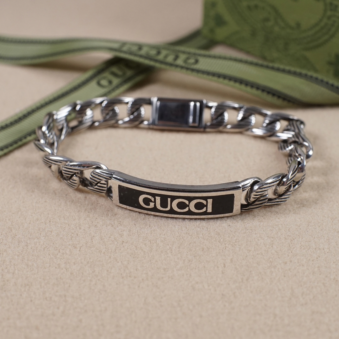 Gucci hand brand distressed bracelet