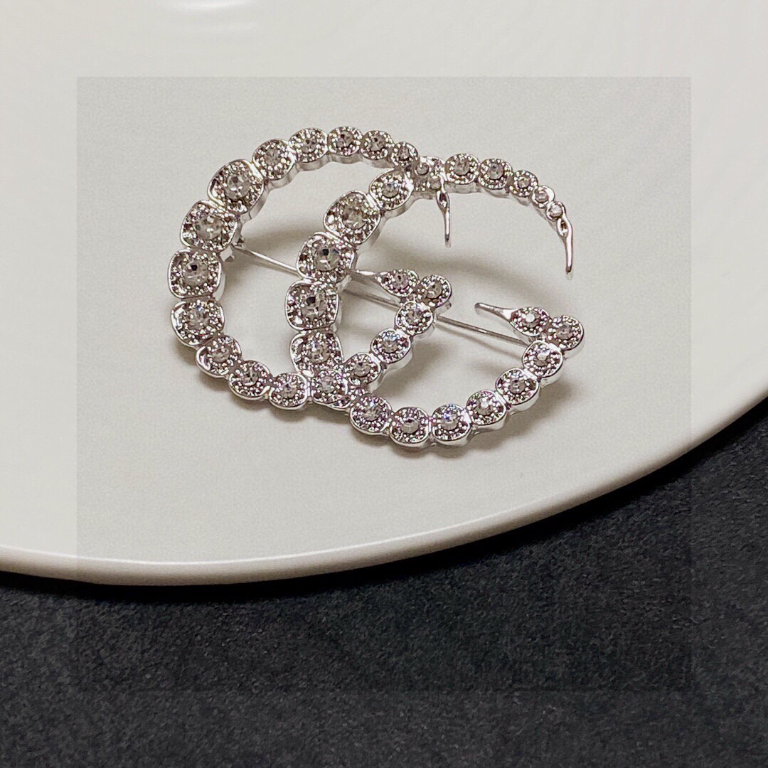 Gucci GG diamond brooch